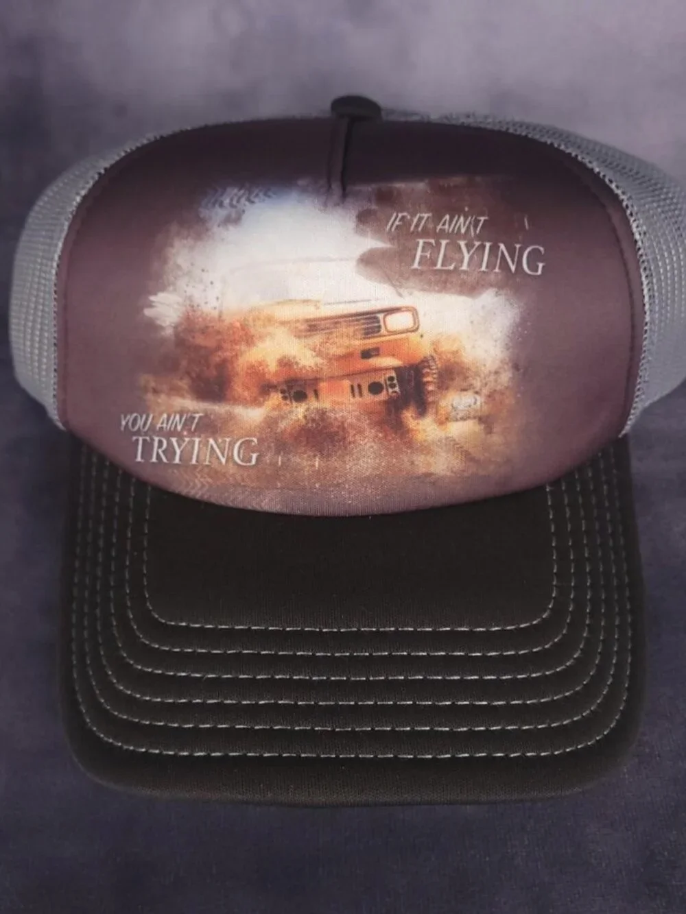 The Mountain If It Ain't Flying You Ain't Trying embroidered trucker cap hat